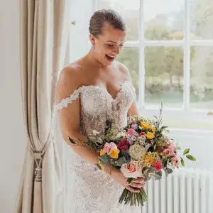 Bride holding a bright pastels Bouquet